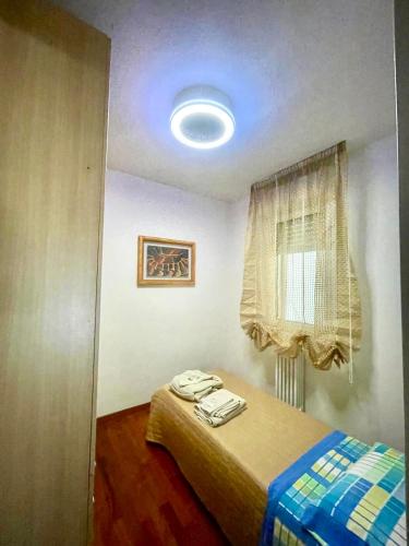 a bedroom with a bed in a room with a window at Suite Gravina + box auto privato in Gravina in Puglia