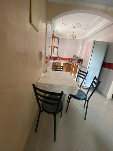 a dining room with a table and chairs at Valley House Imi Ouaddar in Imi Ouaddar