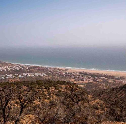 a view of the ocean from the top of a mountain at Valley House Imi Ouaddar in Imi Ouaddar