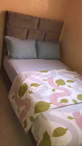 a bed with a blanket on top of it at Valley House Imi Ouaddar in Imi Ouaddar
