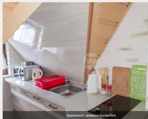a kitchen with a sink and a counter top at Domek u Socków in Zakopane