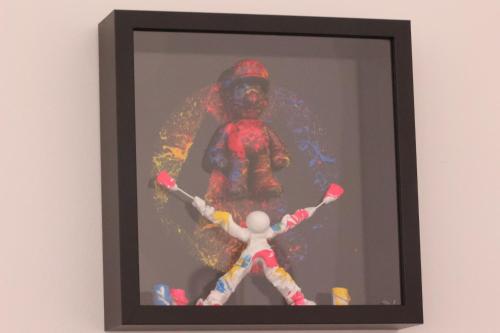 a framed picture of a spider man and a toy at Chez Marie in Rosheim