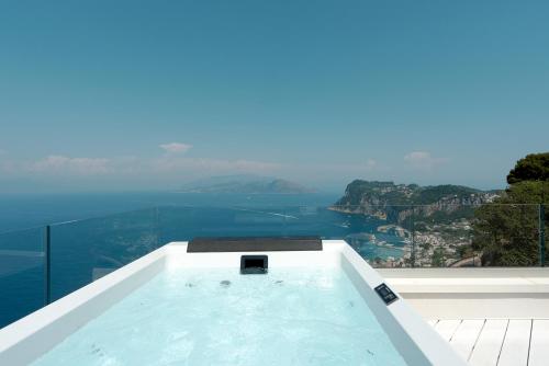 a swimming pool with a view of the ocean at Hotel San Michele in Anacapri