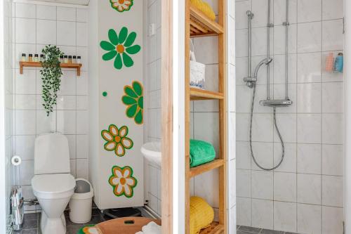 a bathroom with a toilet and a shower at Family Home - Coastal Calmness in Stockevik in Skärhamn