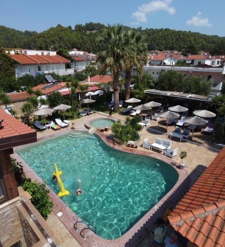 an overhead view of a swimming pool at a resort at EVLOGIA HOTEL SEAFRONT and ANEX by Greek Pride in Fourka