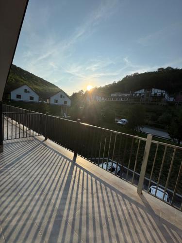 a view of the sun setting from a balcony at MishyN-City Hotel in Dobrovlyany