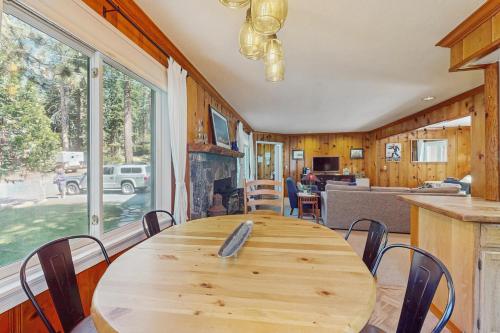 a dining room with a wooden table and chairs at Casual and Cute Cabin Near the Lake in Tahoe Vista