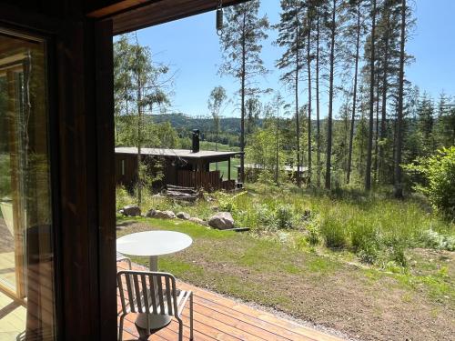 a view from the porch of a house at Sukha Nordic Retreats in Arvika