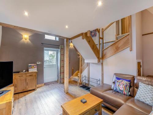 a living room with a couch and a loft at Middlecroft - Uk45062 in Tideswell