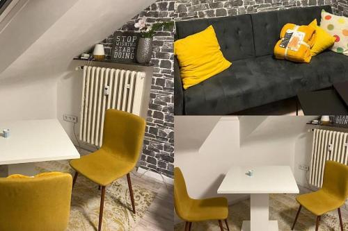 a living room with a couch and two tables and yellow chairs at Singel Apartment Wohnen auf Zeit in Hirschaid
