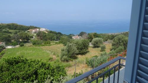 a view of the ocean from the balcony of a house at Borgo Rosso di Sera - Resort Country Chic in San Lucido