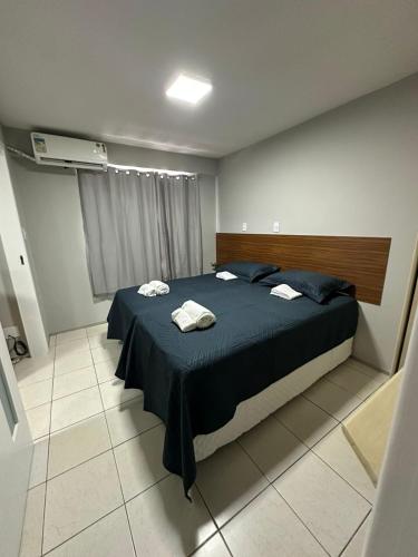 Ένα ή περισσότερα κρεβάτια σε δωμάτιο στο American Flat - Ponta Dareia na Melhor Localização da Cidade com Estacionamento Grátis