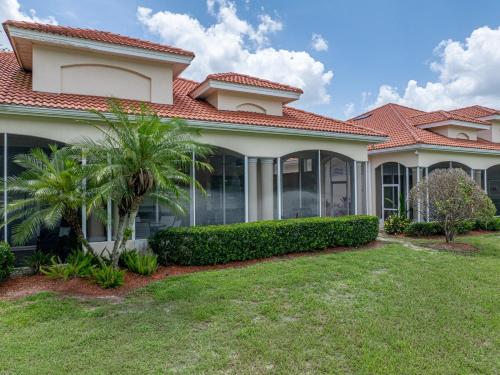 a house with a red roof at Lake Jovita Golf Course Villa in Dade City