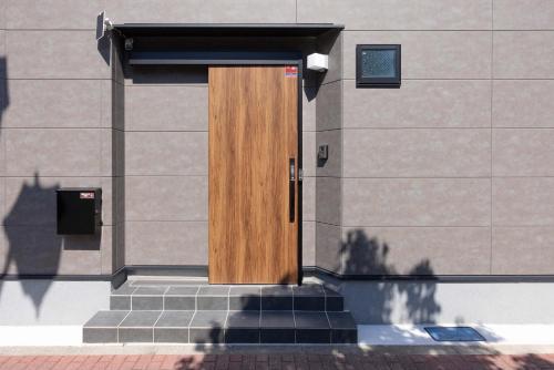 a wooden door on the side of a building at First Choice in Tokyo