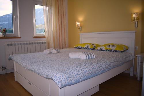 a bed with two stuffed animals on it in a bedroom at Queen of Durmitor in Žabljak