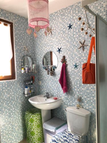a bathroom with a sink and a toilet at Casa Del Angel in Cerbère