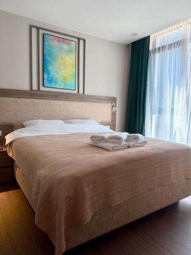 Postel nebo postele na pokoji v ubytování Sun & Style 1BR Apartment