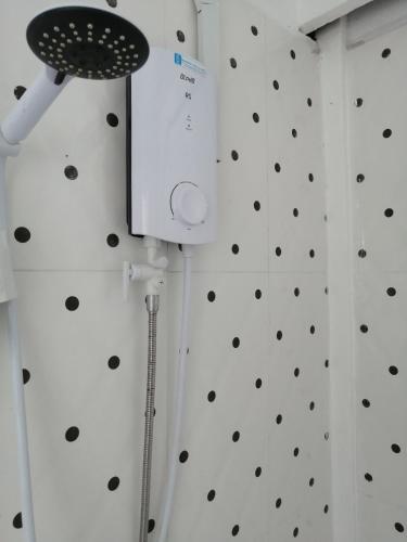 a room with a wall with polka dots at SokSan Seaview Cottage in Koh Rong Island