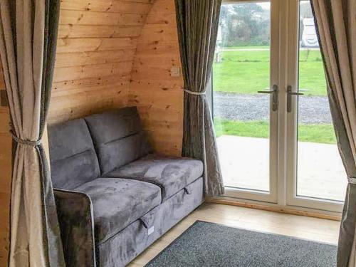 a living room with a couch and a window at Lavender - Uk41385 in Brixham