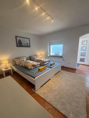 Ένα ή περισσότερα κρεβάτια σε δωμάτιο στο Modernes Apartment mit Parkplatz
