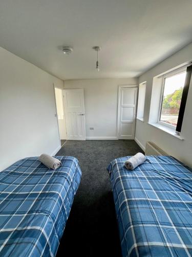 Ένα ή περισσότερα κρεβάτια σε δωμάτιο στο Manchester 2BR Luxe Lounge, Hot Tub, Pool Table