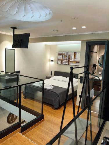 Ένα ή περισσότερα κρεβάτια σε δωμάτιο στο NK Loft