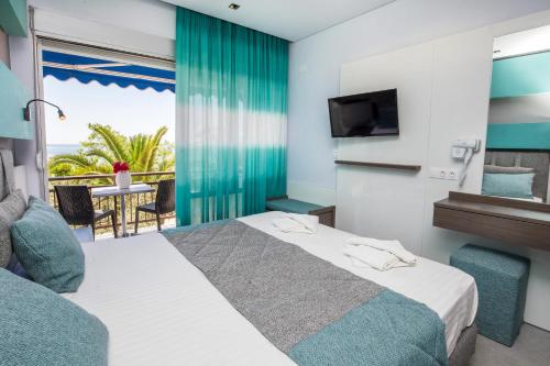 Postel nebo postele na pokoji v ubytování Astris Beach