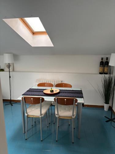 a dining room with a table and chairs at Loggia Rossini in Pesaro