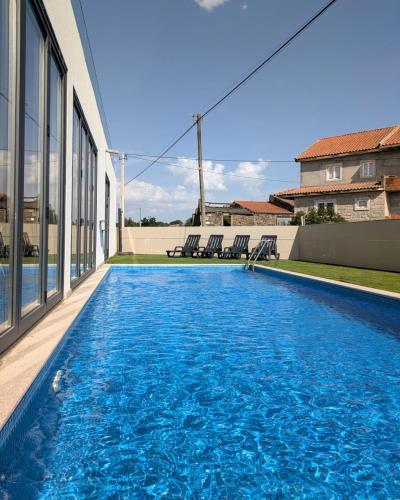 a swimming pool on the side of a building at Casa do Poço in Miranda do Douro
