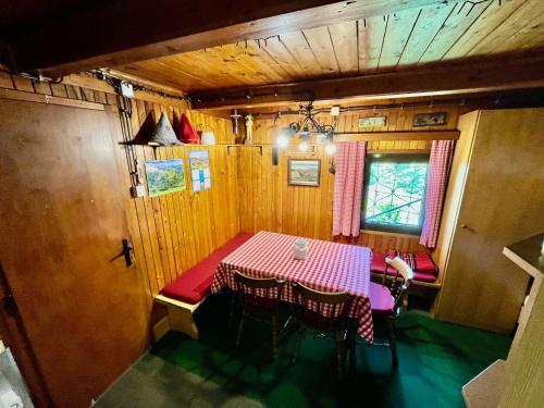 a dining room with a table in a train car at Chalet Kanja Velika Planina in Stahovica