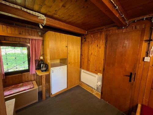 an inside view of a kitchen in a train room at Chalet Kanja Velika Planina in Stahovica