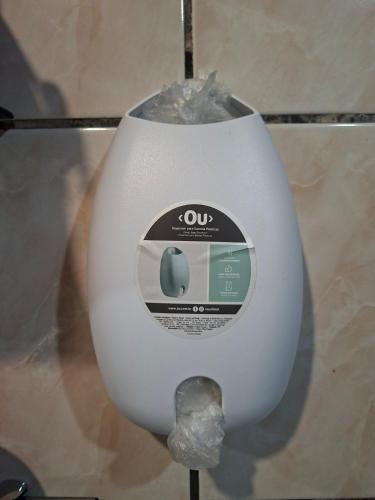 a white toilet with an apple sign on it at Apê confortável, com Alexa. Ótima localização in Ilhéus
