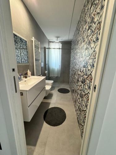 a bathroom with a sink and a toilet at Sul Mare in Molfetta