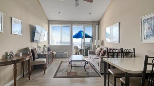 a living room with a couch and a table at Sea Crest in Amagansett
