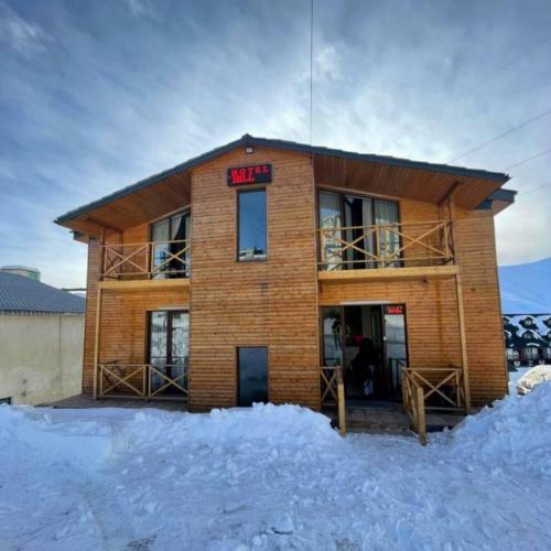 a building with a sign that reads akhtar at Sunny Hill Gudauri in Gudauri