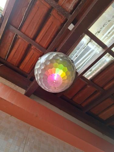 a disco ball is hanging from a ceiling at Apê confortável, com Alexa. Ótima localização in Ilhéus