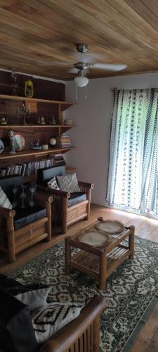 a living room with a couch and a coffee table at Casa de Andréa in Santo António