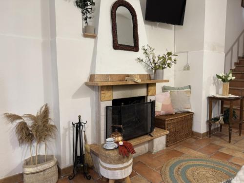 a living room with a fireplace and a tv at La Dolce Casa Centre Free Parking Family in Celano