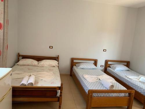 Postel nebo postele na pokoji v ubytování Begaj Rooms