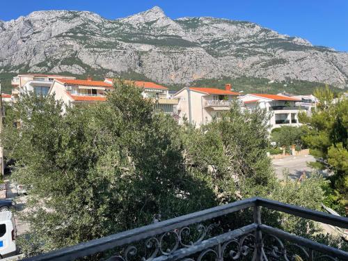 a view of a mountain from a balcony at Apartments Villa More in Makarska