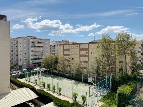 a basketball court in a city with buildings at NOVA PINEDA 2 y VISTAS PISCINA in La Pineda