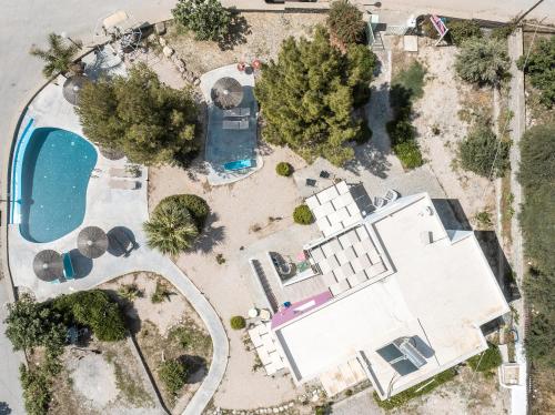 an aerial view of a house with a pool at CrossRhodes Villas in Pefki Rhodes