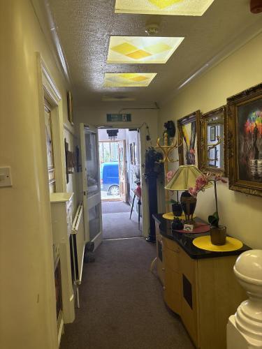 a hallway of a house with a room with a hallway at Evanescent in Blackpool