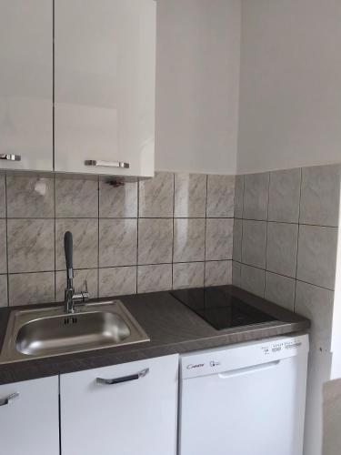 a kitchen with a sink and a counter top at Apartman Nina Vrlika in Vrlika