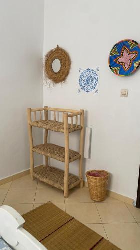 a room with a wooden shelf on a wall at Moroccan Family House in Agadir
