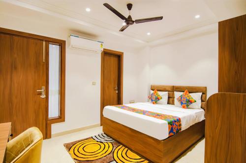 a bedroom with a bed and a ceiling fan at Family stay Prem Dlx Hotel -3'Minutes WalkFrom NDLS Railway Station in Jāmb
