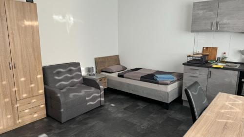 Kuchyň nebo kuchyňský kout v ubytování Gästezimmer Fateev 8