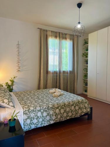 a bedroom with a bed with a stuffed animal on it at Denise B&B 