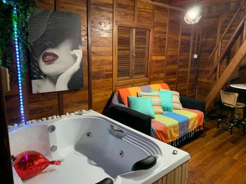 Postel nebo postele na pokoji v ubytování Chalé com Hidromassagem
