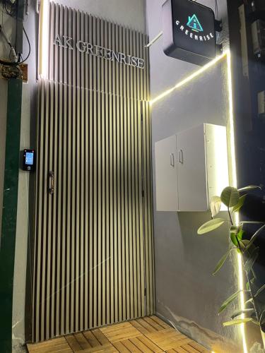 a door with a sign on the side of a building at AK Greenrise Meru in Ipoh